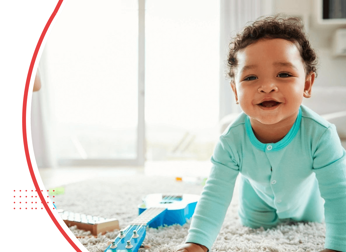 Happy mixed race toddler boy crawling in sitting room